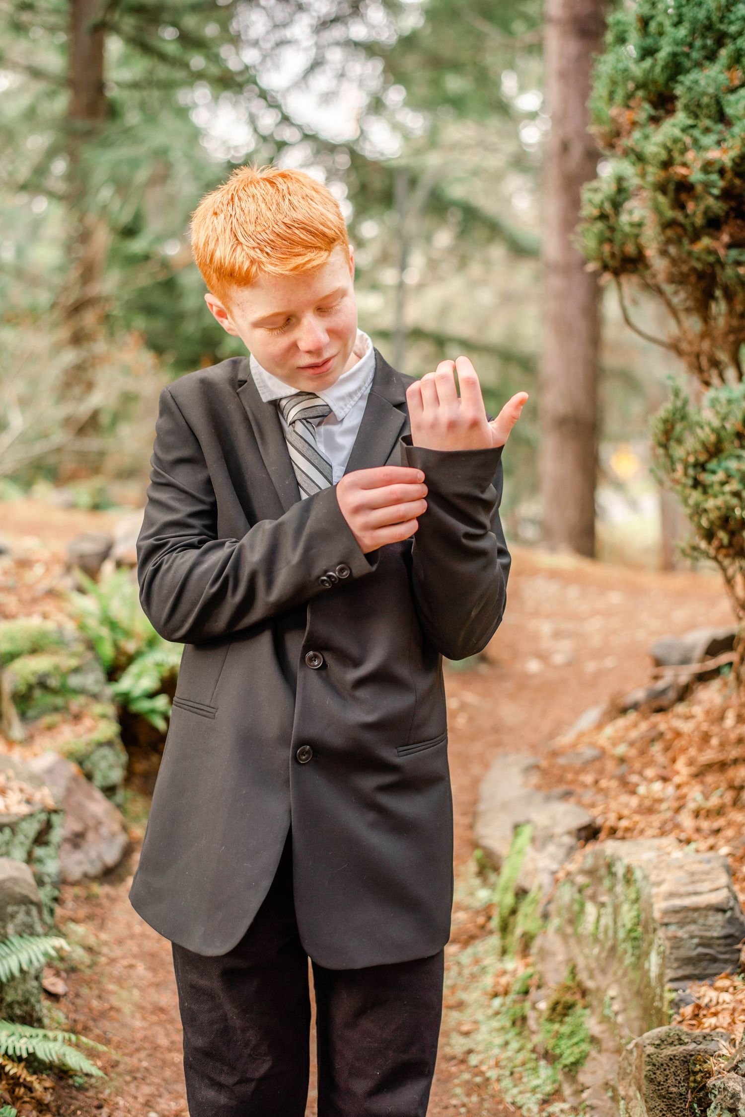Natural outdoor photography session showing expressions and gestures in a wooded setting.