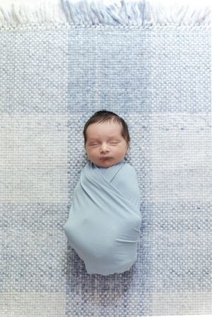 newborn wrapped at home