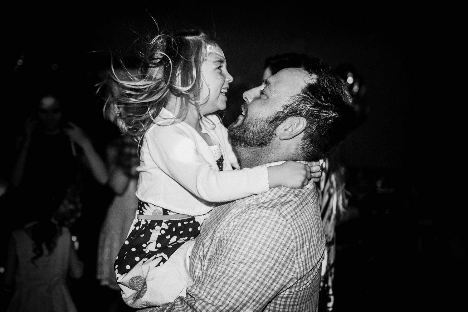 Black and white photo of dance partners enjoying a romantic evening.