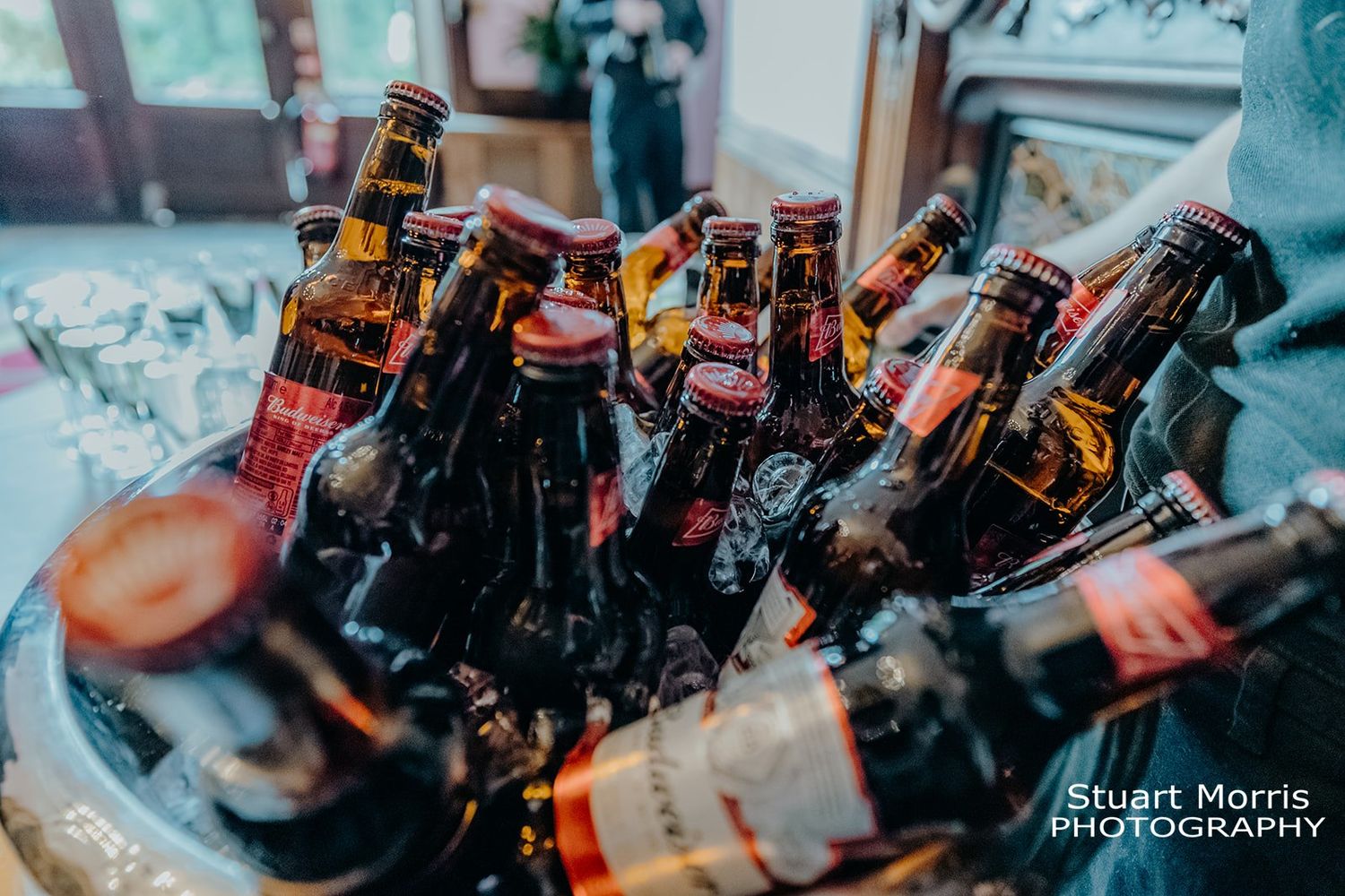 bottles of beer chilled in ice ready for wedding guests at Ruthin castle. Stuart Morris Photography.