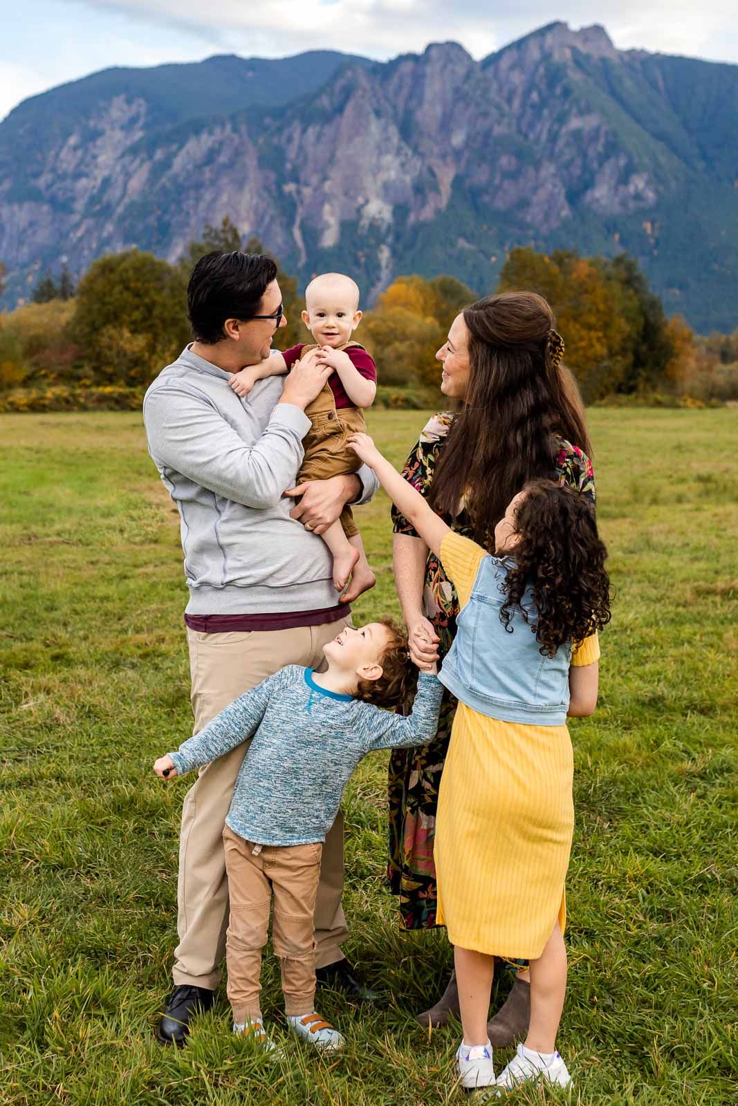 Family having fun with each other and smiling in North Bend.
