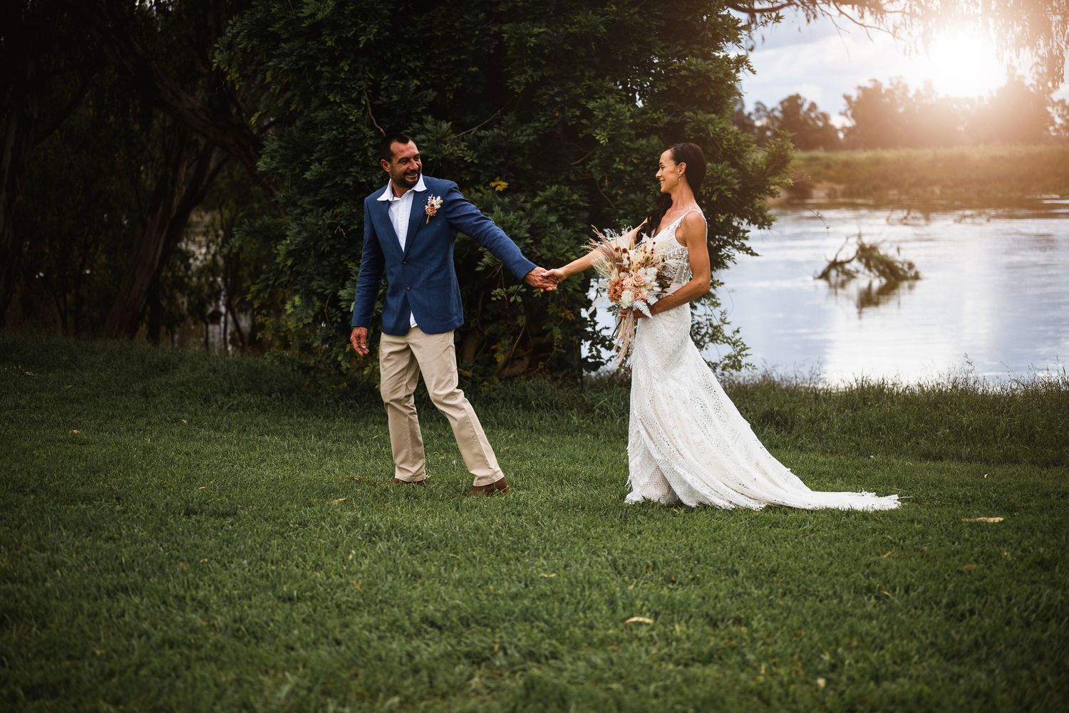 Bride and Groom walking hand in hand at sunset Dubbo Photographer