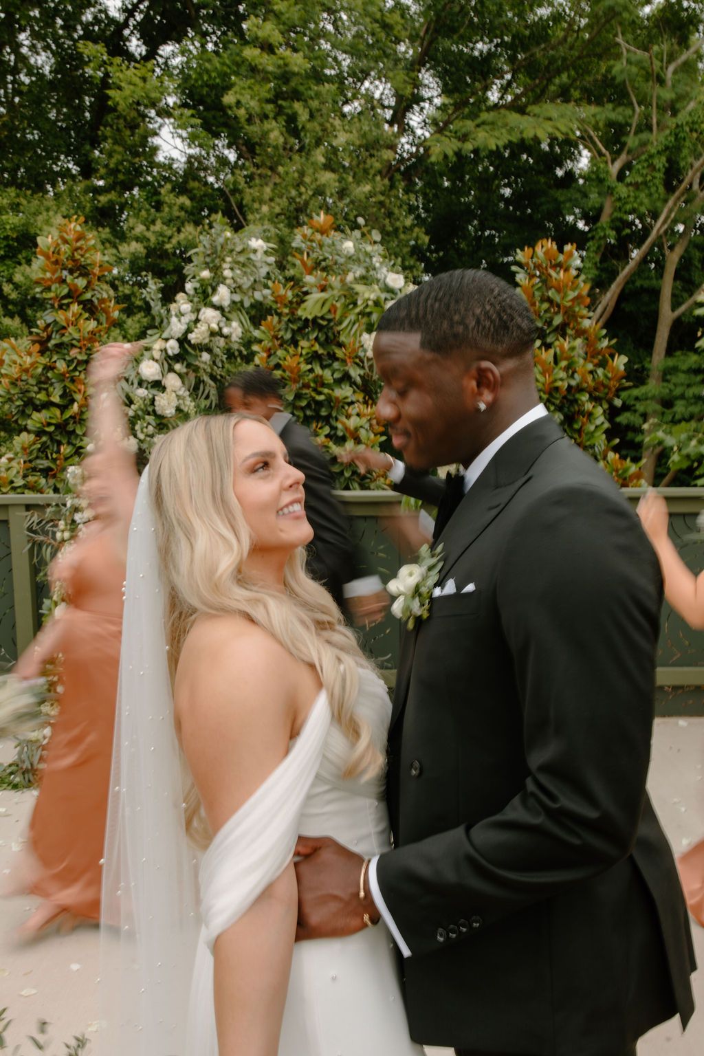 bride and groom looking at each other at their luxurious wedding day