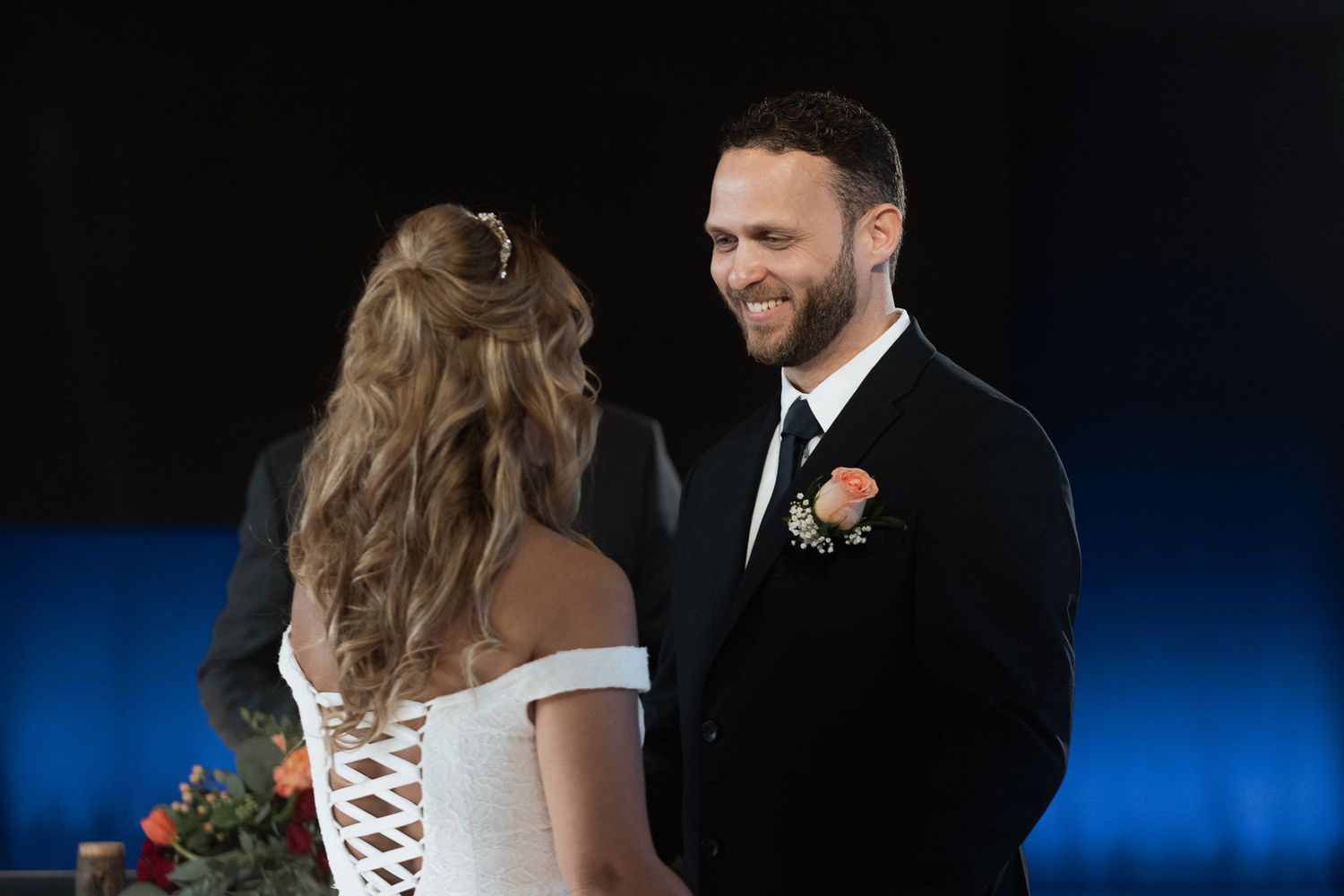 Romantic first dance moment captured at an evening wedding reception.