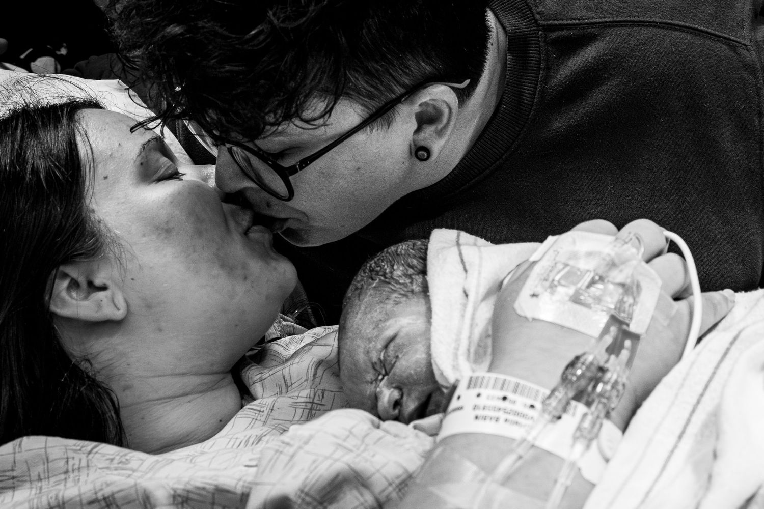 Black and white portrait series showing intimate moments of loving affection and connection.