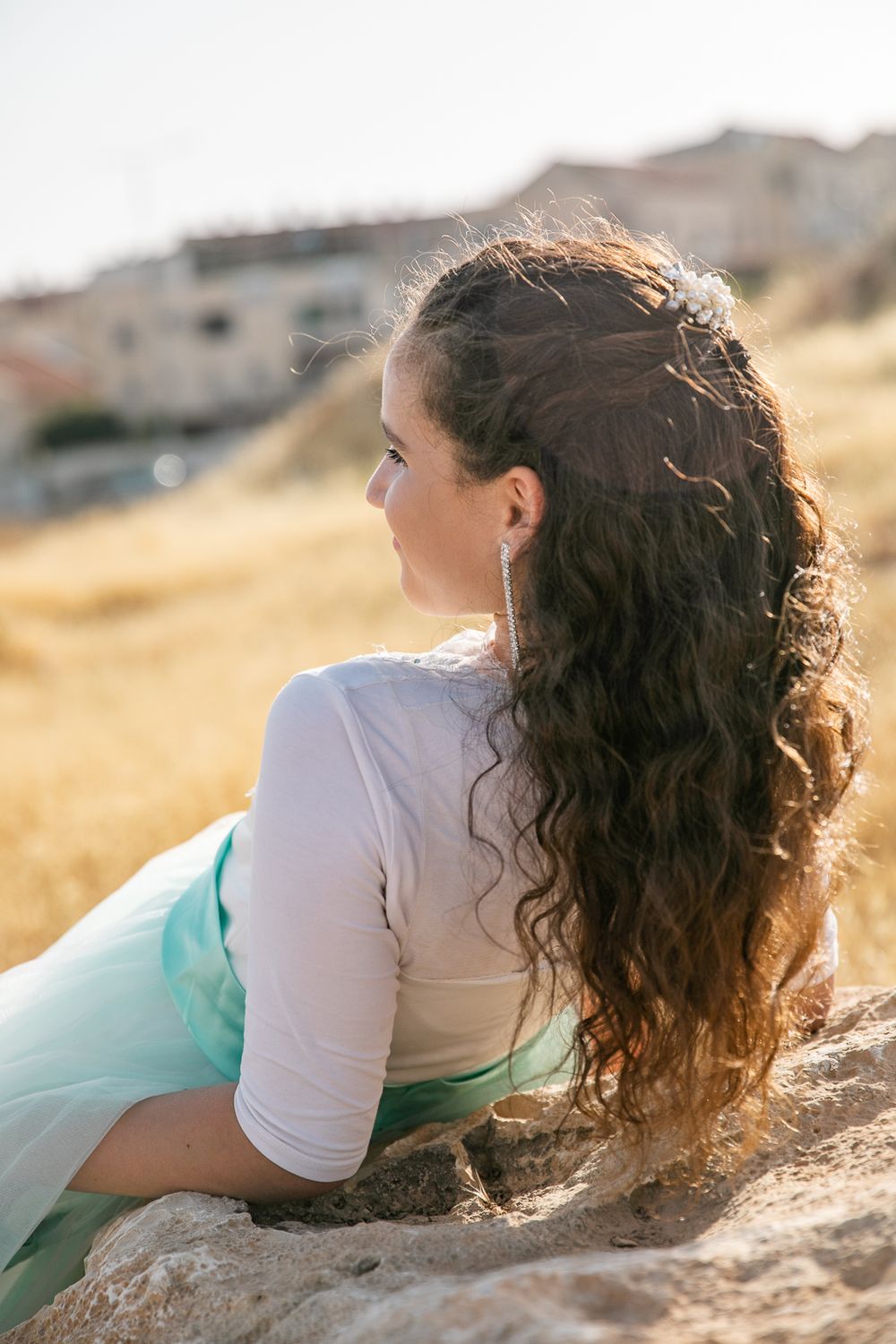 a beautiful girl looks aside to the landscape