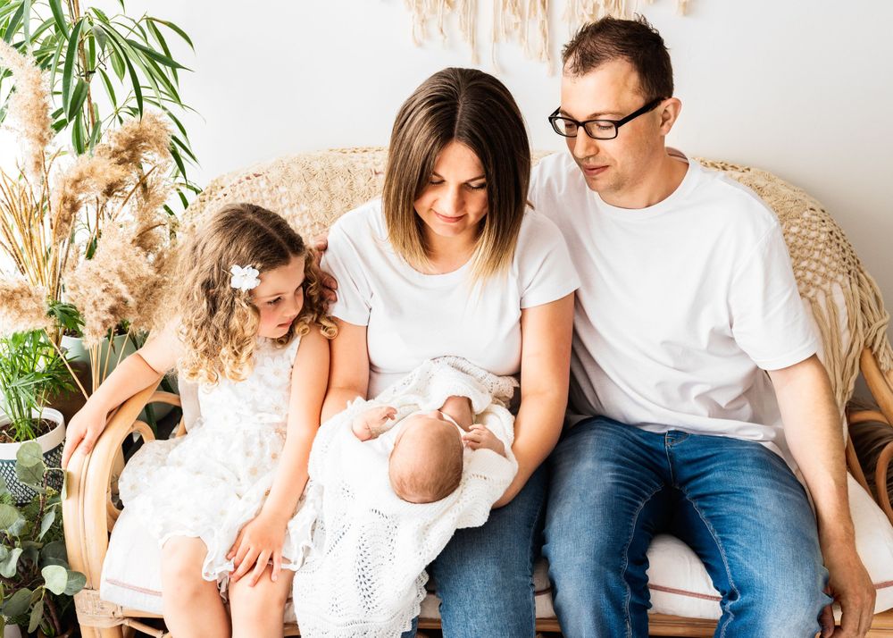 all white family with toddlers photos in all-white studio Hereford