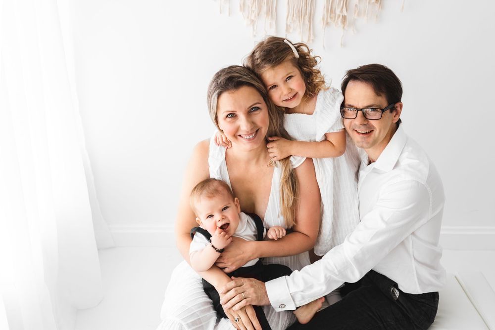 all white family with toddlers photos in all-white studio Hereford