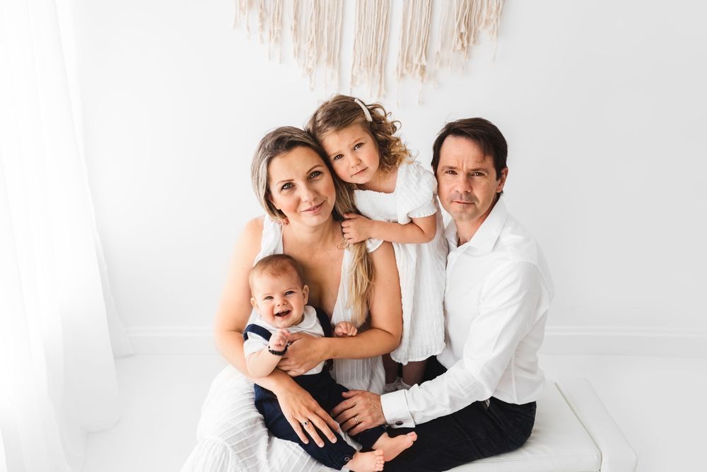 all white family with toddlers photos in all-white studio Hereford