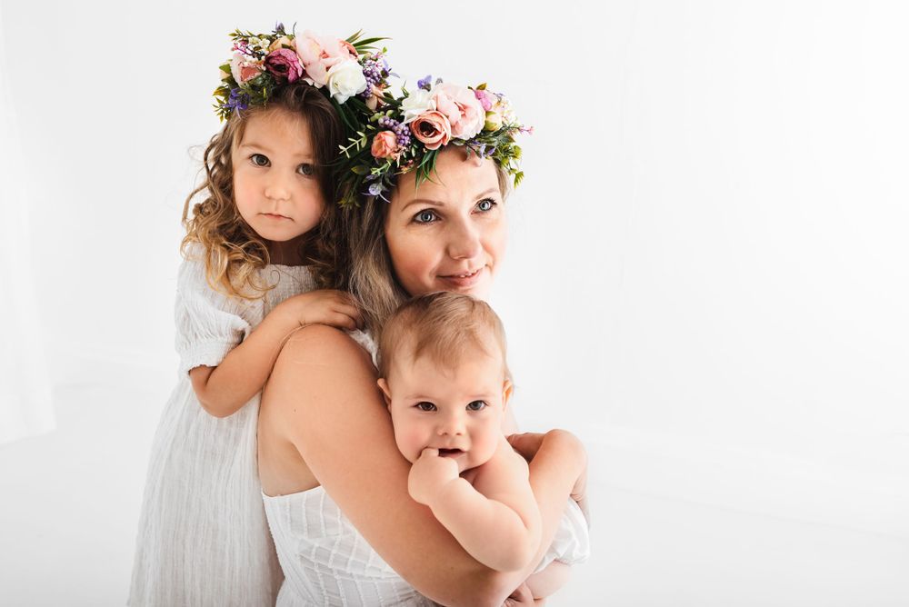 all white family with toddlers photos in all-white studio Hereford