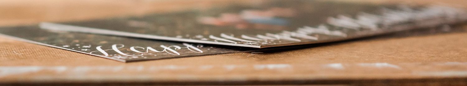 Side view of stacked papers or cards showing layered edges.