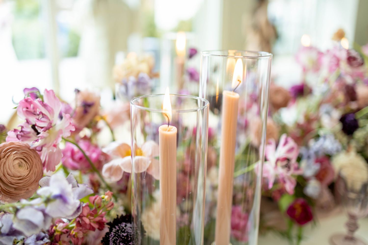 Candles on a wedding table shot in the light and airy style