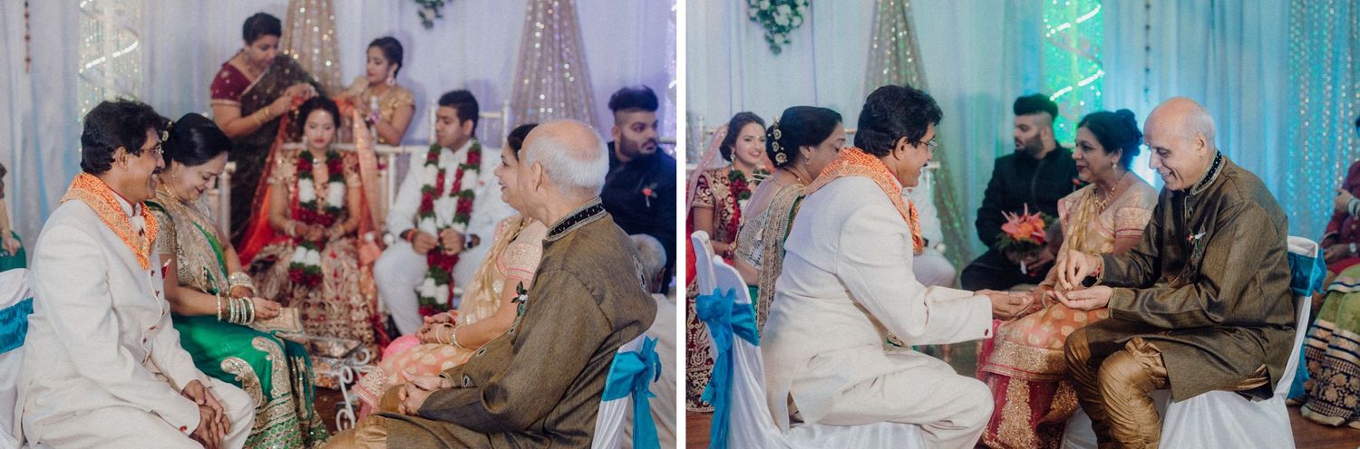 Traditional Indian wedding ritual being performed with family members seated on floor.