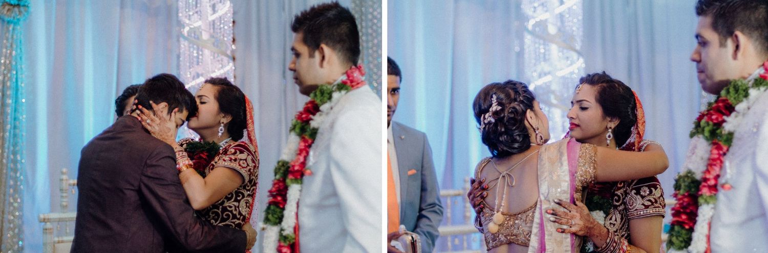 Emotional moments during an Indian wedding ceremony with family members embracing.