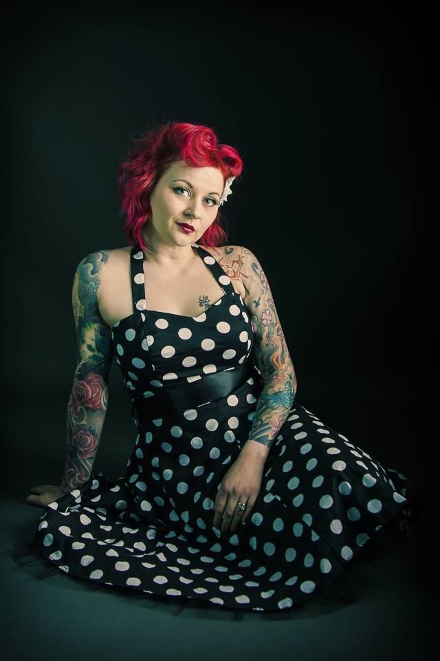 Pin-up portrait of a red haired woman taken in a portrait studio by Dandridge glamour and boudoir photographer.