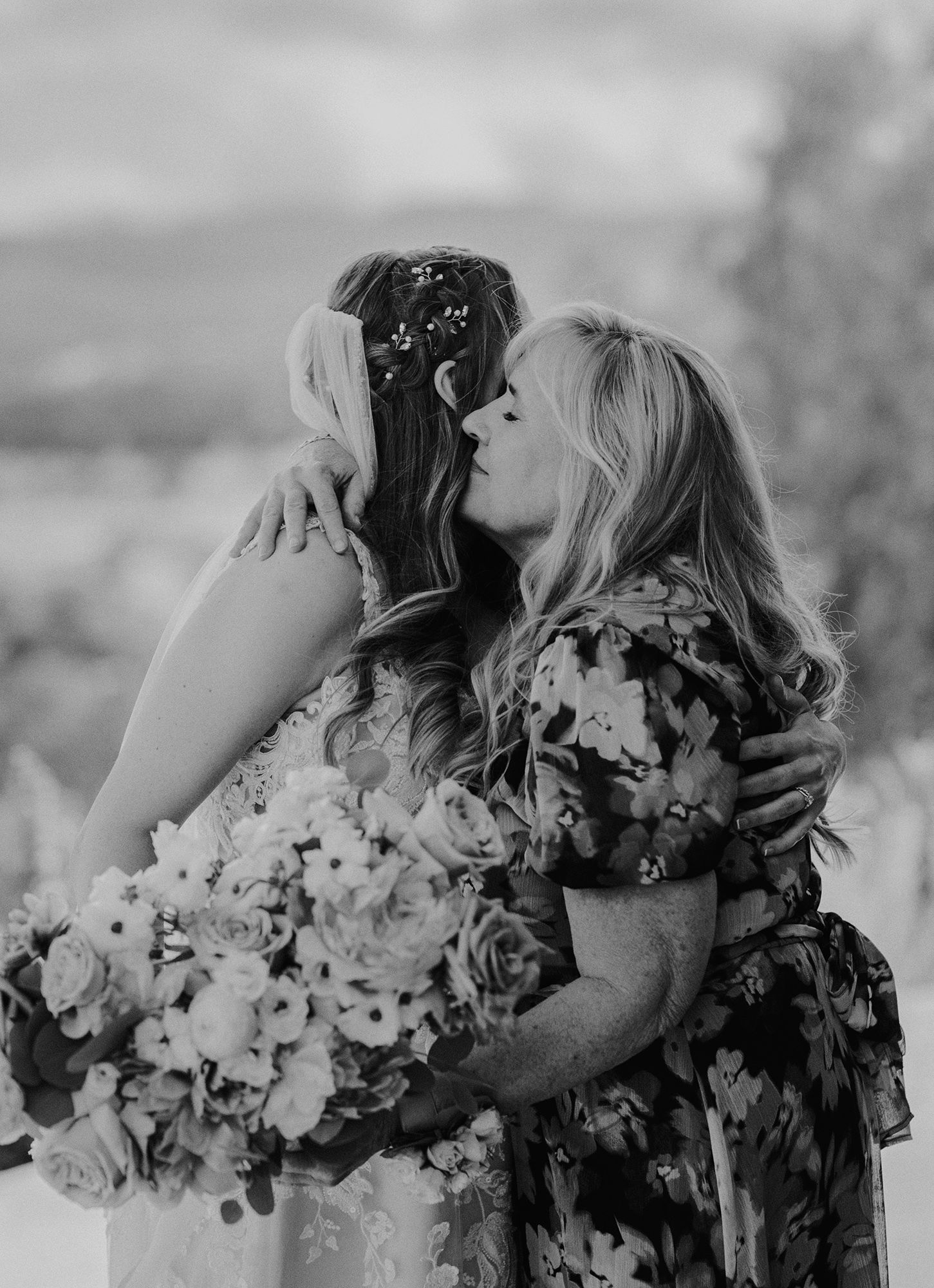 E Noelle Photography in-home wedding in Hidden Hills Los Angeles, bridal orange, candid of mother of bride hugging bride