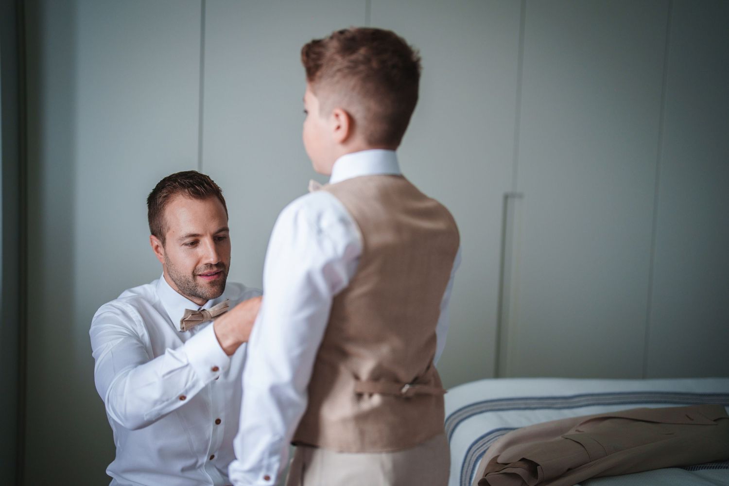 An emotional conversation between two people dressed in formal wear.