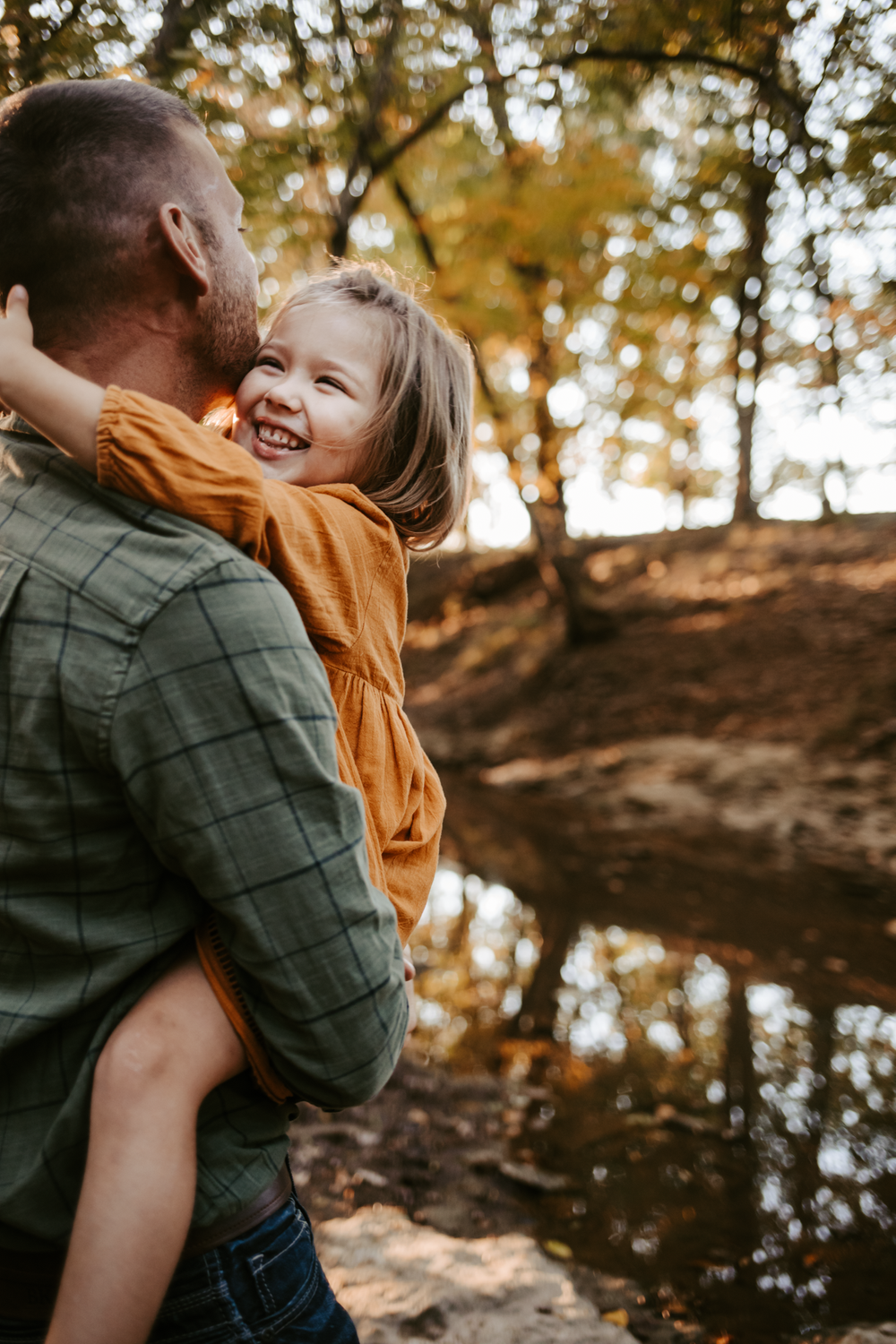 Dad holding daughter