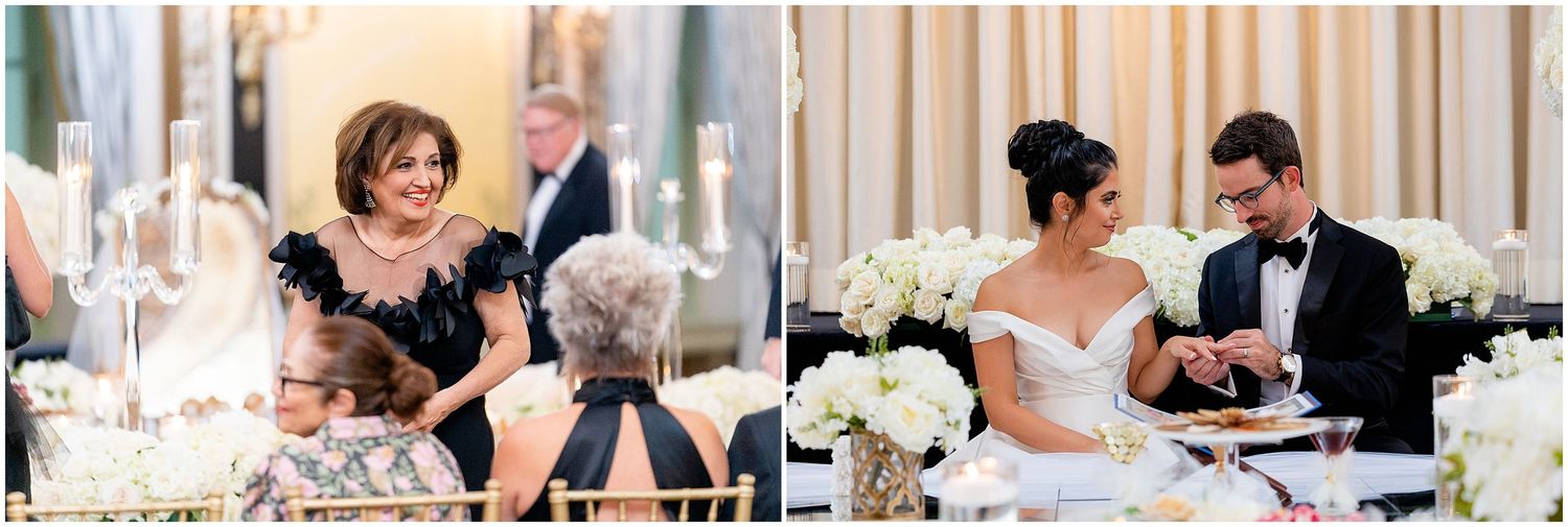 Wedding reception guests enjoying speeches and toasts at an elegant dining table with white floral centerpieces.
