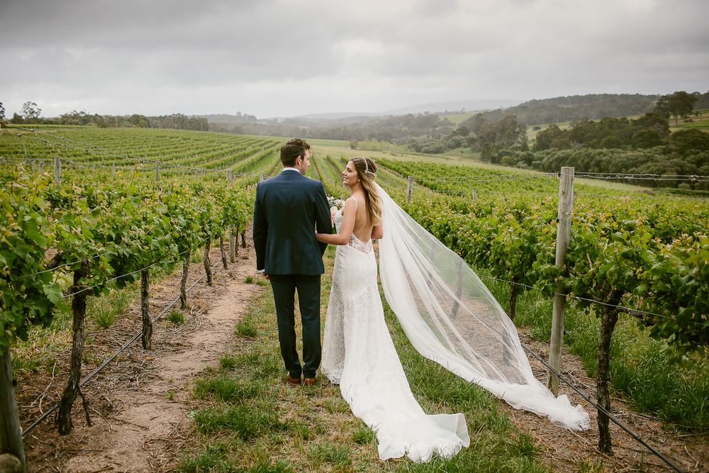 Bride and groom walking into the vineyard at their Will Domain Winery wedding