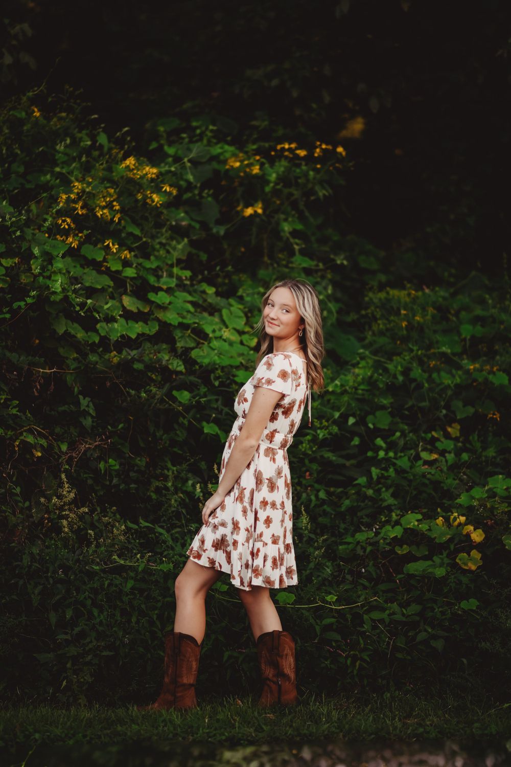Artistic portrait series against dark foliage background with natural lighting.