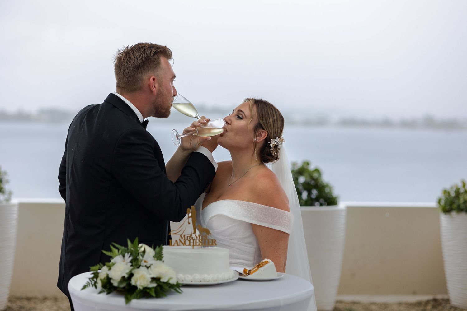 Bride and Groom drinking champagne