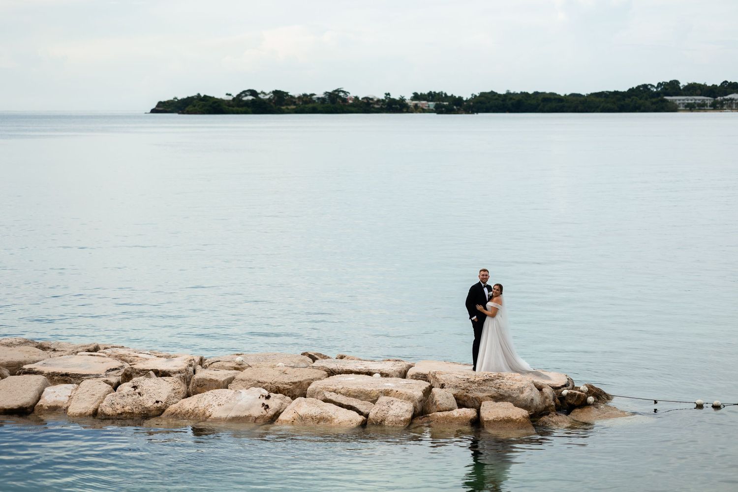 Bride and Groom posing in Jamaica by the sea