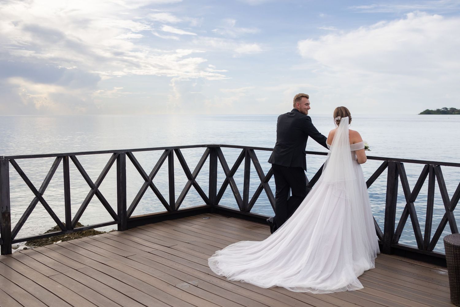 Bride and Groom looking out to the sea in Jamaica