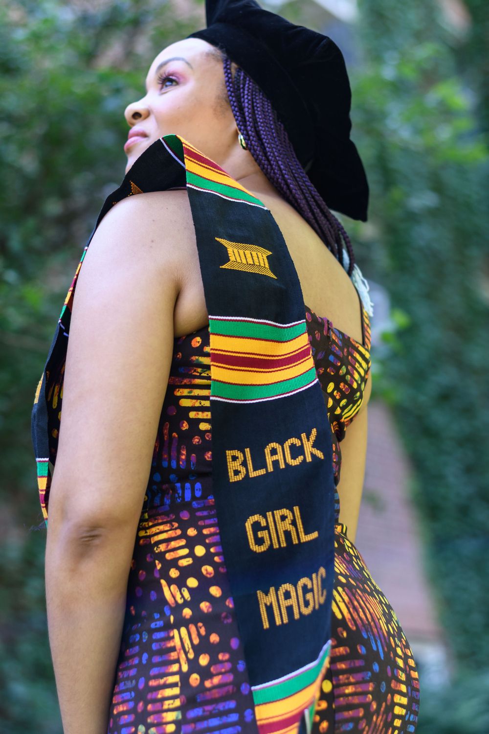 Colorful African print dress with Black Girl Magic text design shown from side angles.