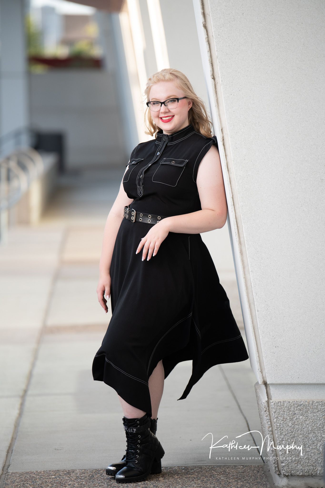 Kathleen Murphy Photography picture of a girl in a black dress in an urban location