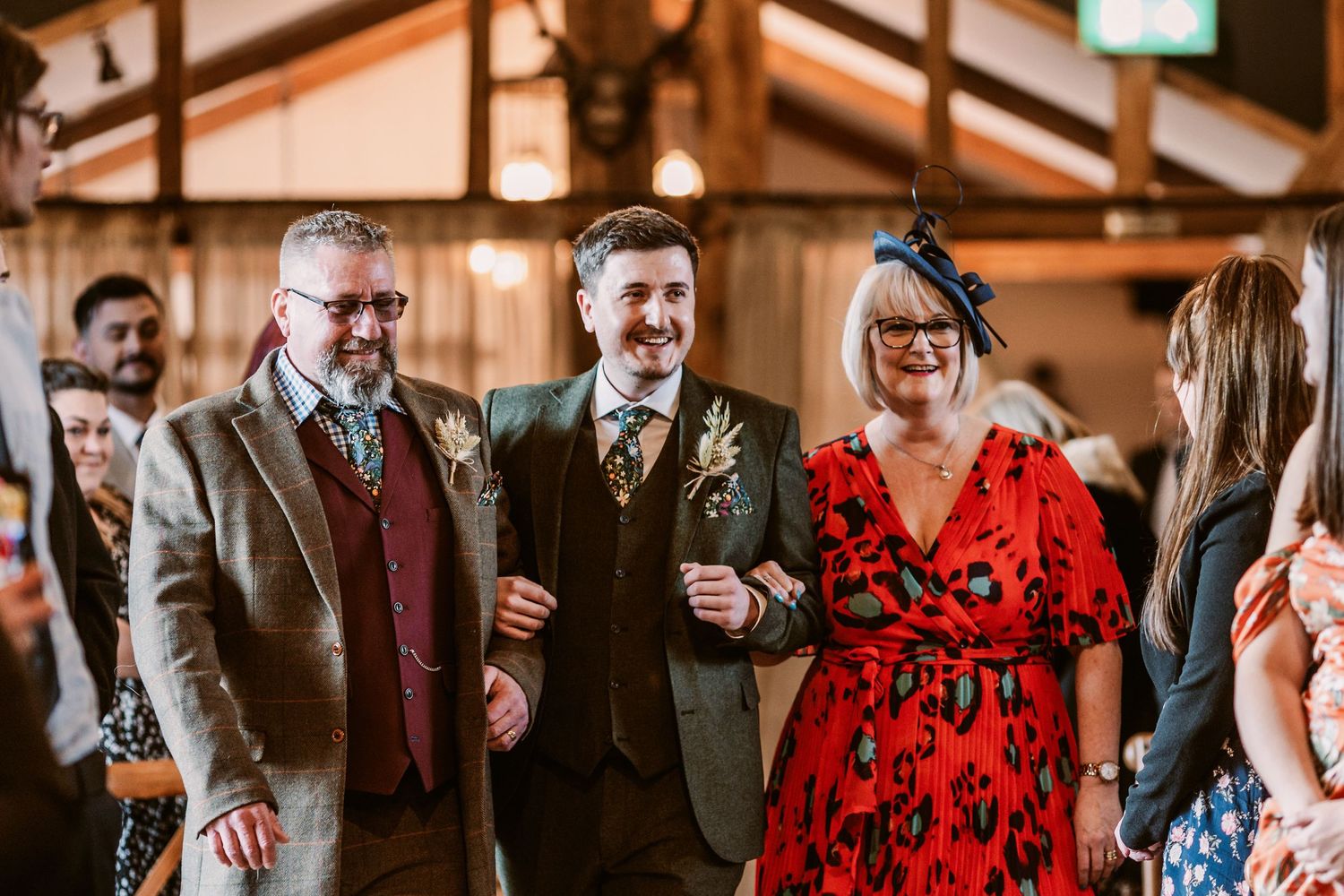 A lively wedding reception scene with guests dancing and celebrating.