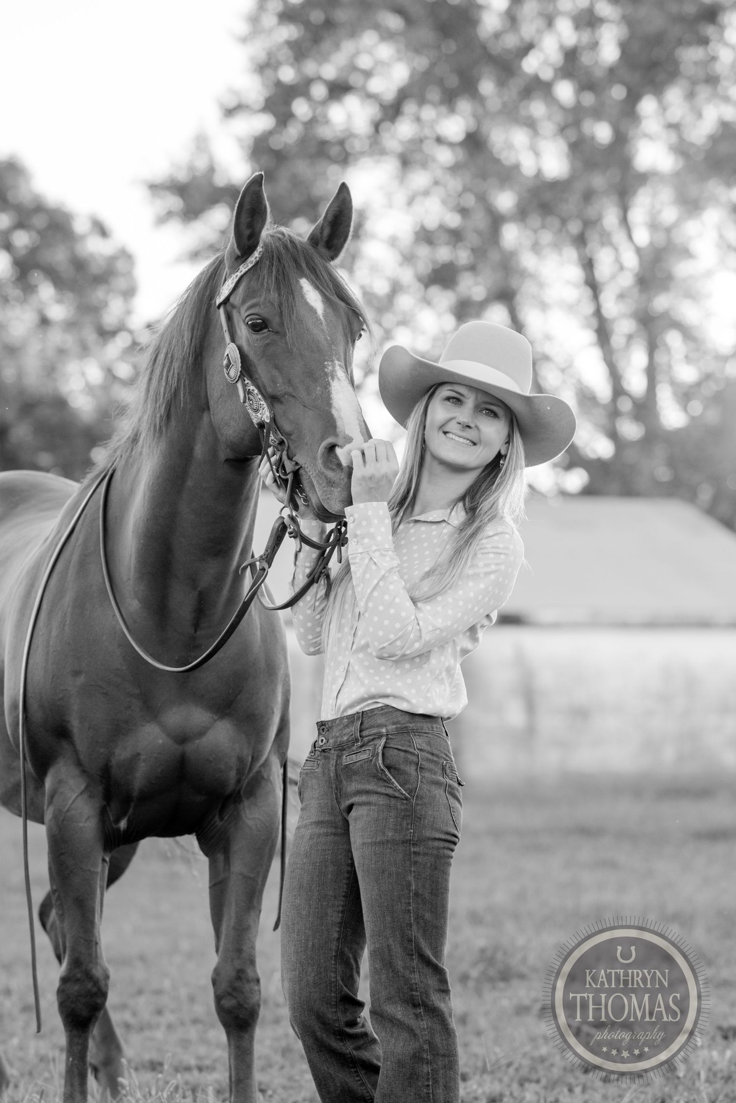 A black and white portrait of a horse and handler showing their special bond in a country setting.