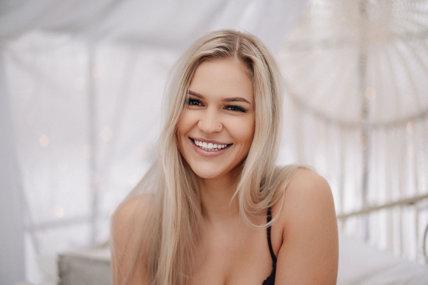 Natural light portrait with joyful expression.