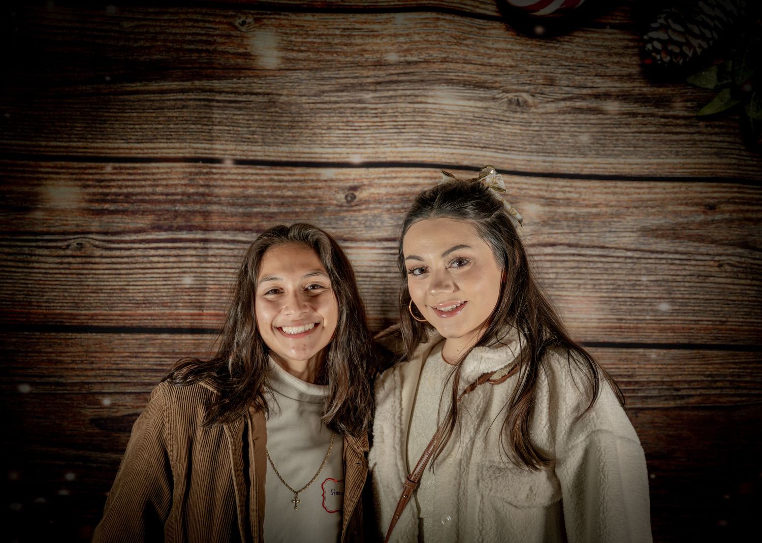 Candid portrait series showing happy couples against wooden wall background.