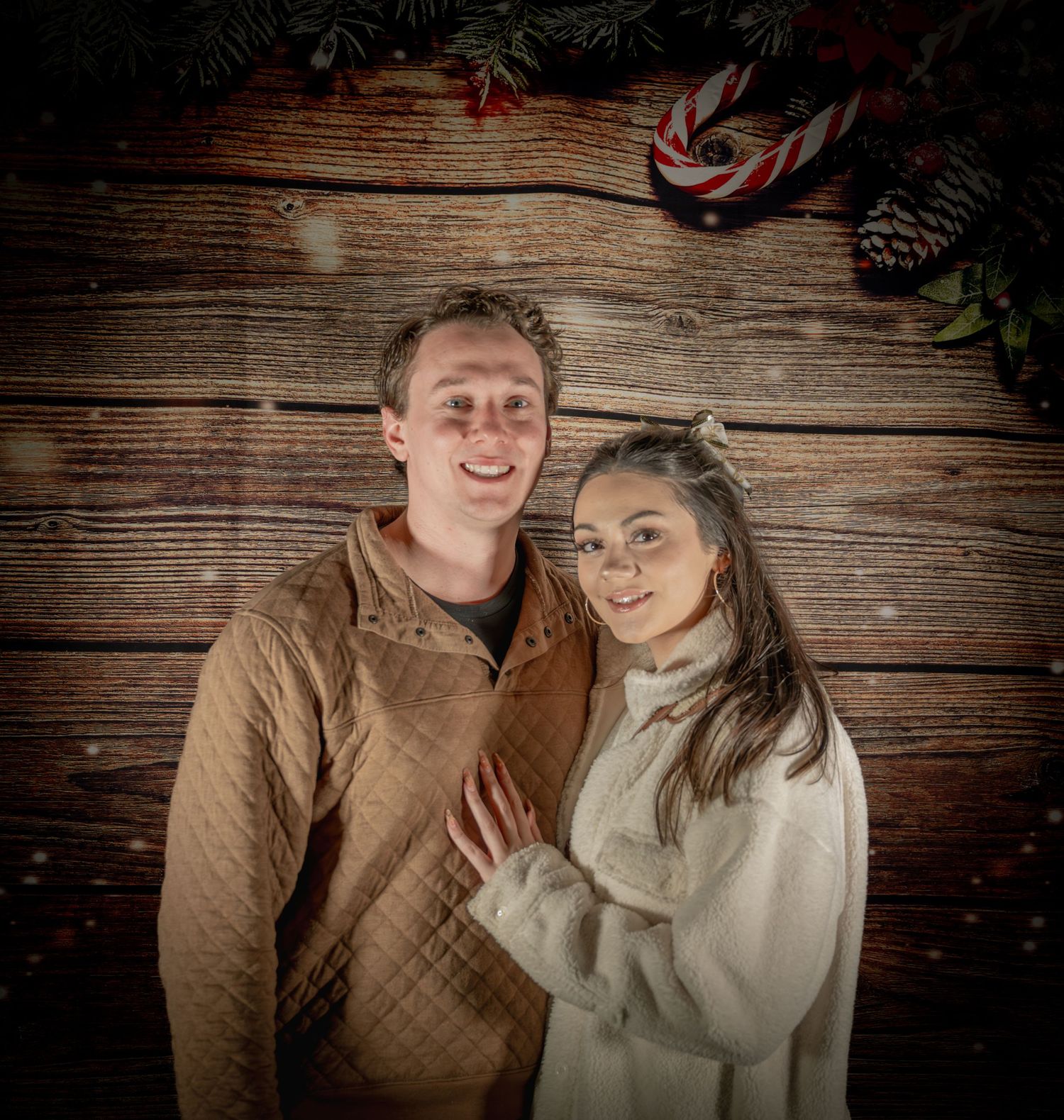 Couples sharing intimate moments during holiday photoshoot with rustic decor.