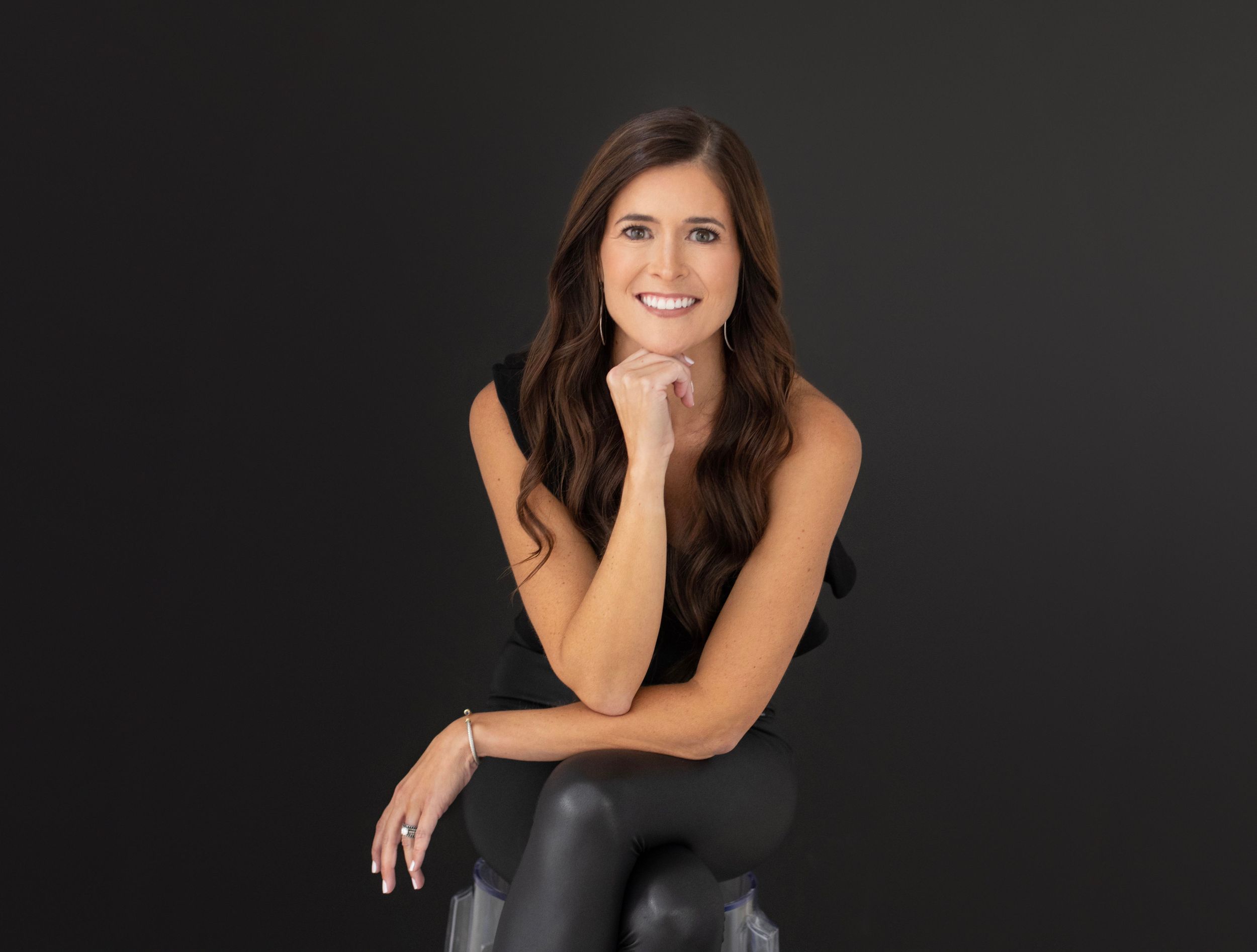 Professional headshots against dark background showing different poses and expressions.