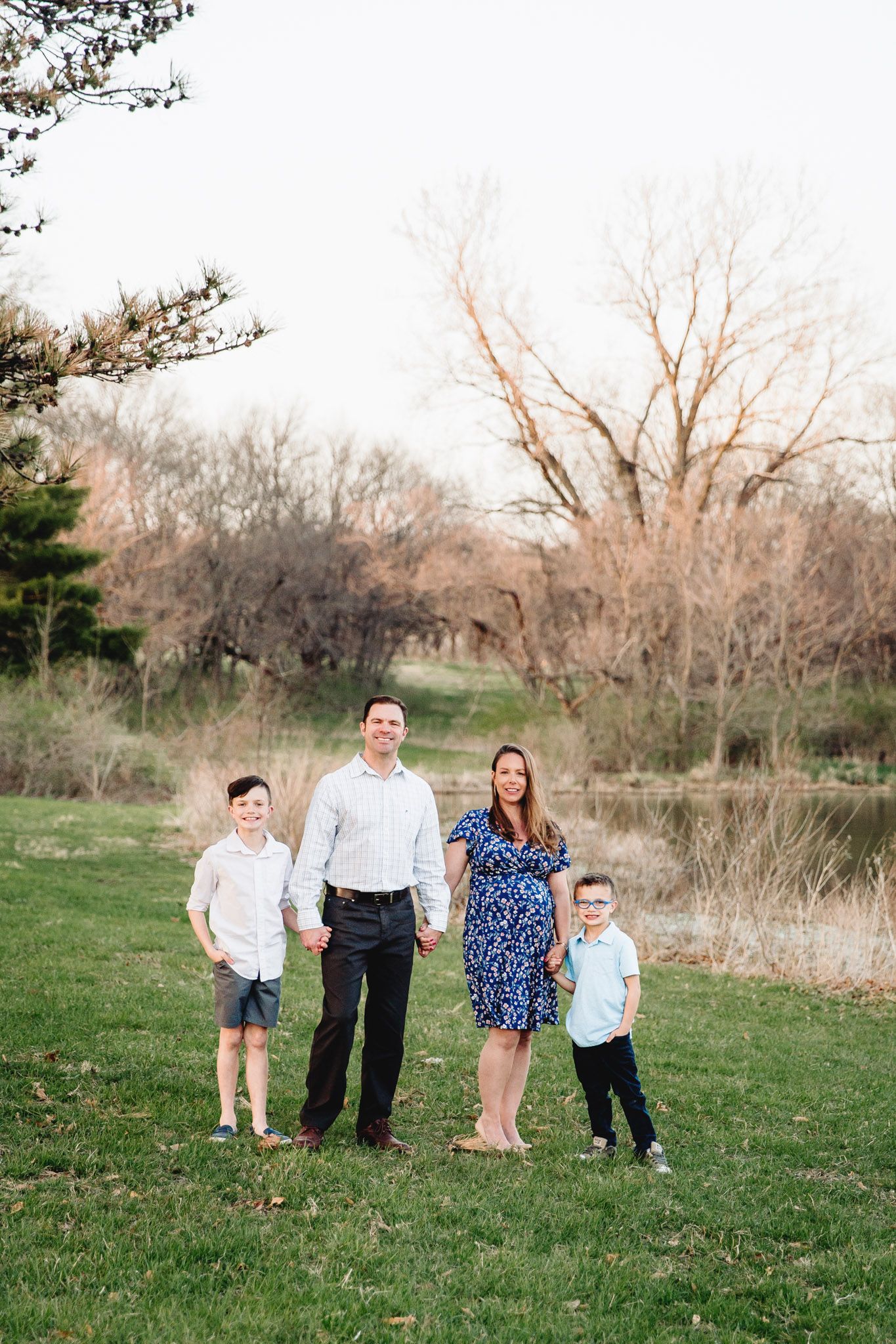 family holding hands near water overland park kansas