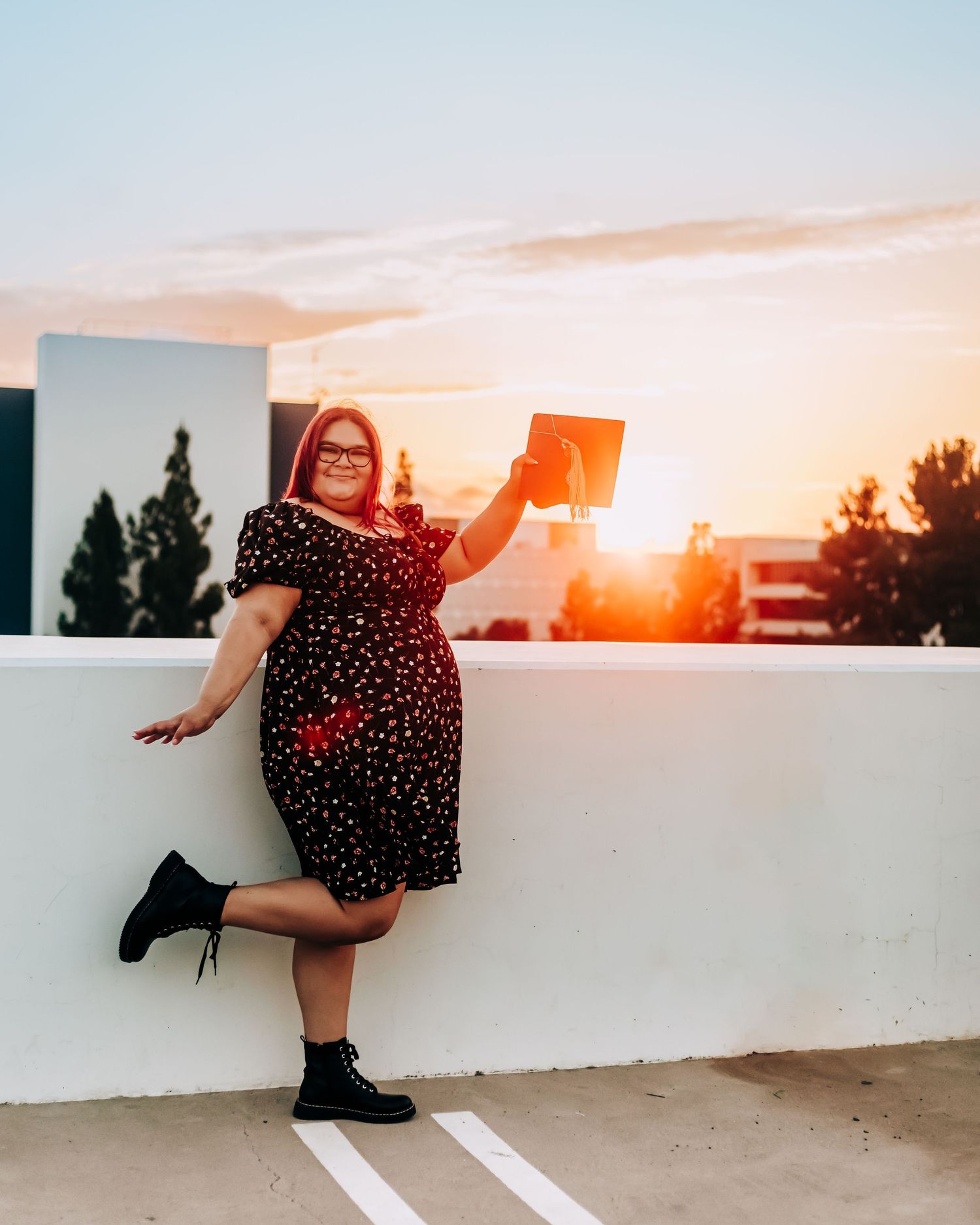 college graduate on parking garage rooftop at Cal State Fullerton in California