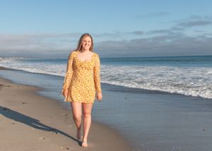 High school girl walking on the beach at Capistrano Beach