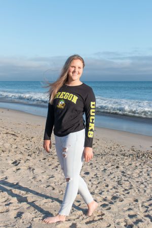 High school girl session with college shirt at the beach in Capistrano Beach