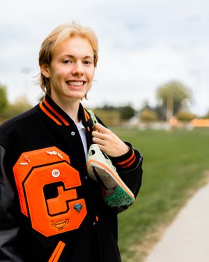 Close-up shots of an orange varsity letter jacket with school insignia.