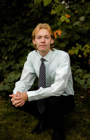 Professional portrait series featuring white dress shirt and striped tie in natural outdoor setting.