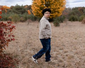 Walking sequence captured against autumn landscape with dry grass and fall trees.