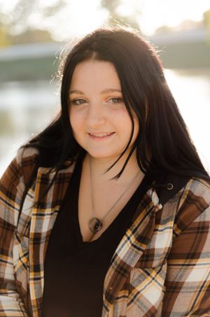 Close-up portrait series with natural backlighting and a plaid flannel shirt.