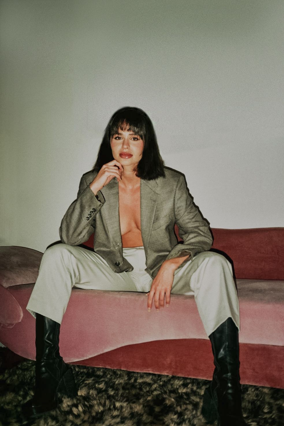 35mm film fashion portrait of woman in her home dressed in open grey blazer
