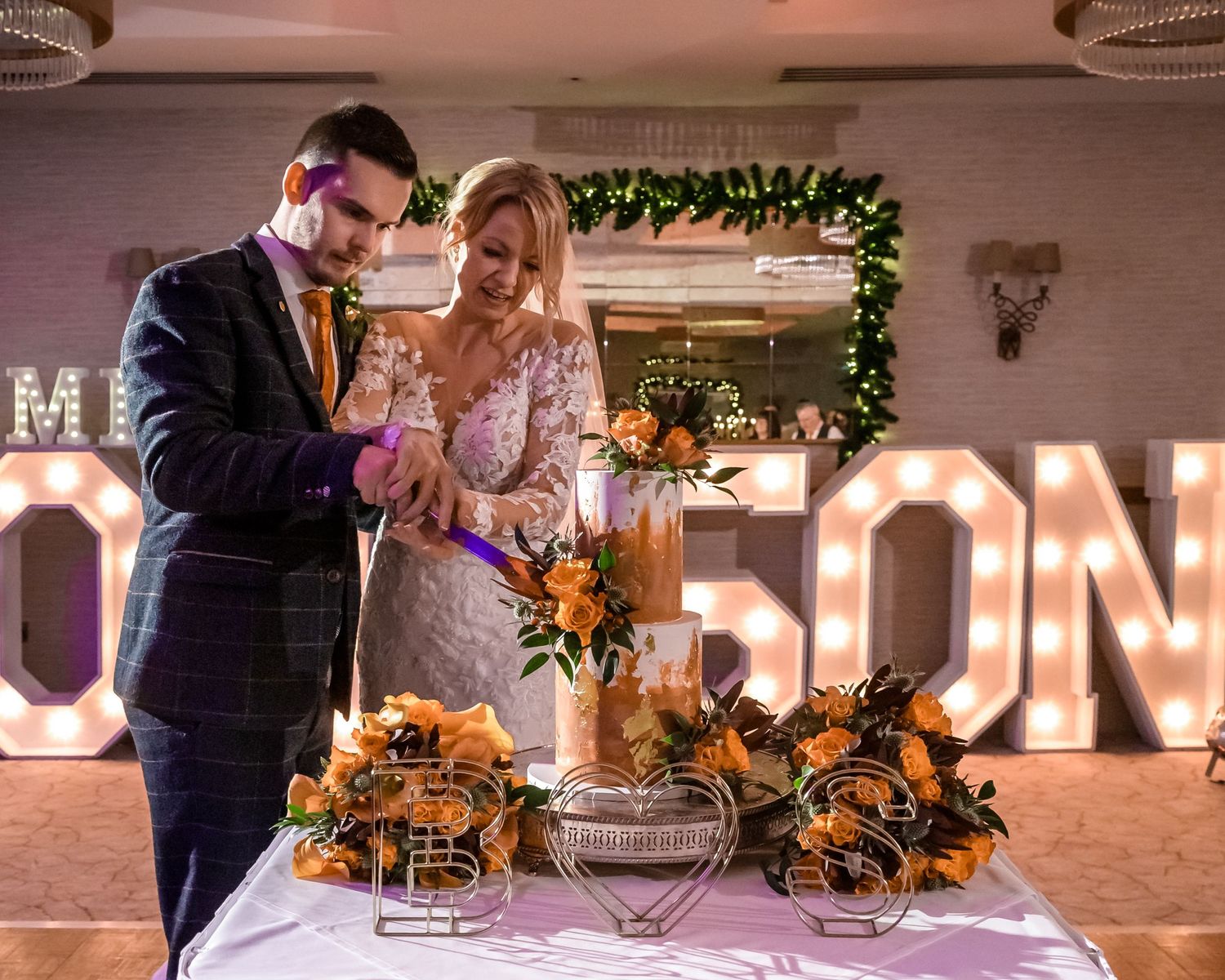 Bride and groom cutting cake at Lodore Falls Hotel wedding