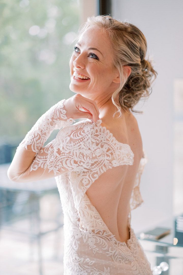 Bride getting dressed for her wedding