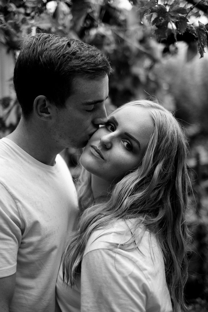 Boyfriend and girlfriend pose outside