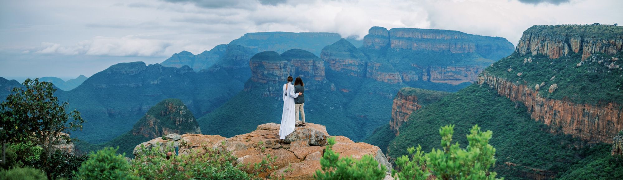 Married couple overlook Blyderiver Canyon, Mpumalanga
