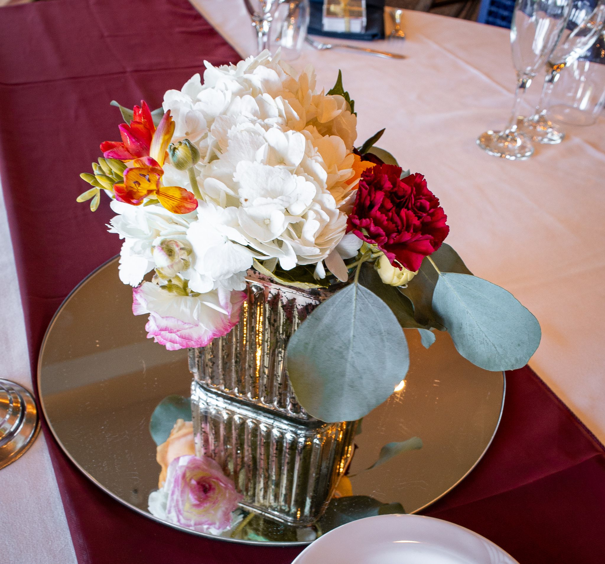 fresh florals centered on the table elegant place setting mirrored glass exposurecreativeside